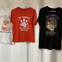 Red, Black, And Grey T-shirt’s With Messages On Them 