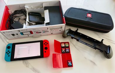 Nintendo Switch + 5 Games + 128GB microSD Card + Travel Case + Console Grip