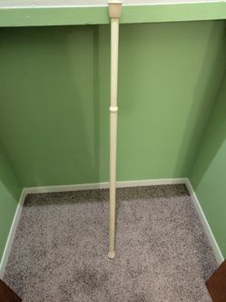 White spring loaded tension rod