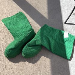 Green boots platic heels cloth top comes up to your calf.