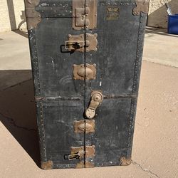 Antique metal trunk with four drawers