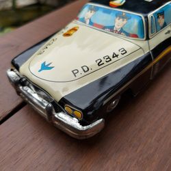 Vintage metal friction patrol car