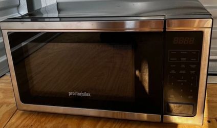 Proctor Silex 1.1cuft.1000 Watt Microwave Oven stainless steel and black.12"Hx21"Wx18"D