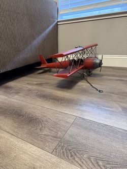 Vintage style red metal airplane