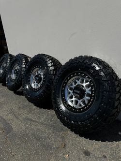 FINANCING AVAILABLE KMC KM549 GRS 8x6.5 17" Machined Wheels with 35” Toyo Open Country M/T Tires Machined with Black Lips