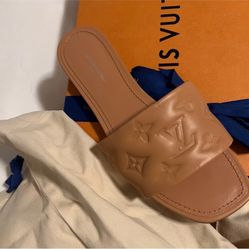 Cream Louis Vuitton slides