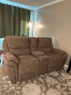 Movie suede teddy brown recliner chair good condition with middle compartment