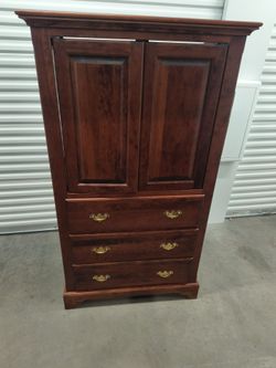 Woodley armoire with pocket door tv