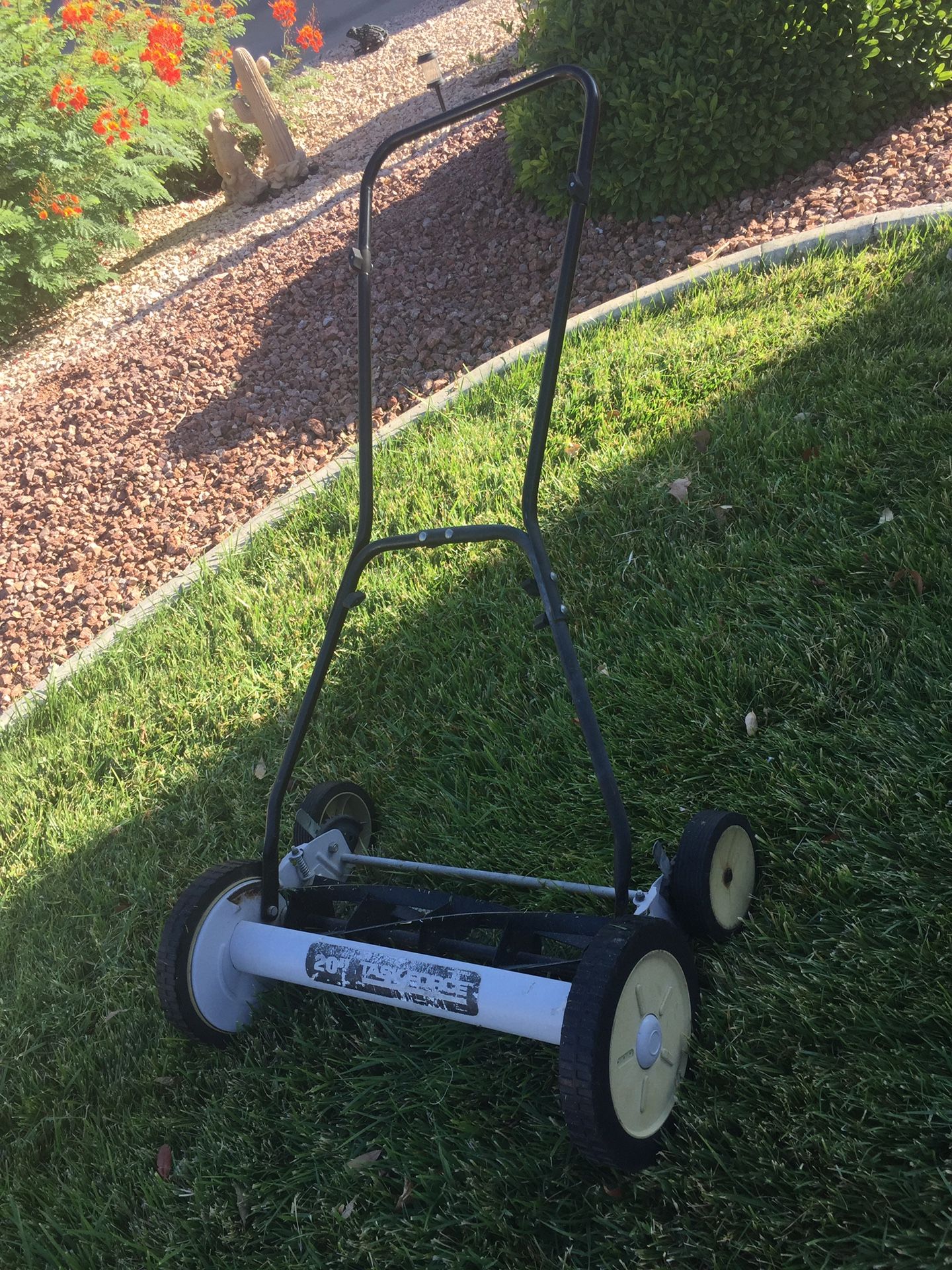 Task Force reel mower, slices off grass rather than wacking it off like