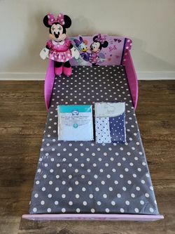 Minnie Mouse Wood & Metal Toodler Bed - By Delta
With Mattress, One Sealy Waterproof Crib Mattress Pad, One Fitted Crib Sheet, and Minnie Mouse Build-