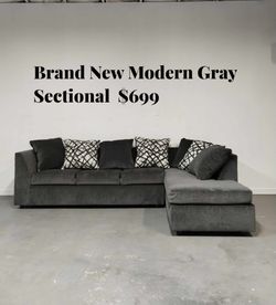 🛋️ Brand New Modern Gray Sectional – $650  Stylish and comfortable L-shape design perfect for any living room. ✅ Brand new condition ✅ Soft gray fabr