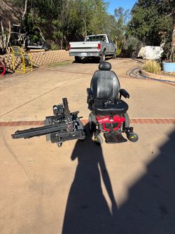 Red Power Wheelchair with Lift Attachment