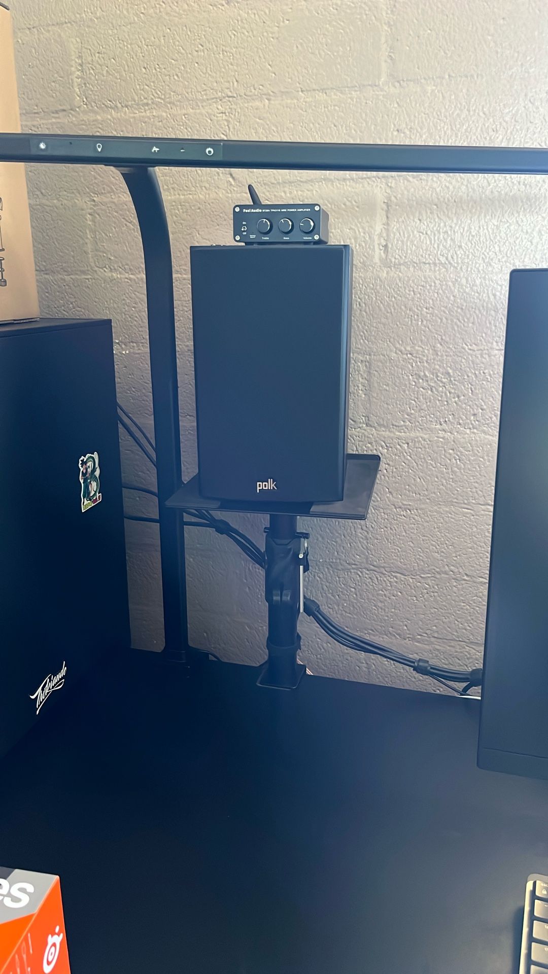 Polk Audio T15 speakers, Fosi Audio V1.0B mini amplifier, and desk-mounted speaker stands, without any speaker wires