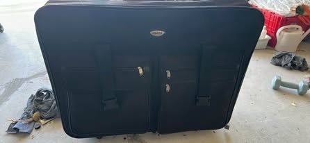 Black Rolling Suitcase. And luggage