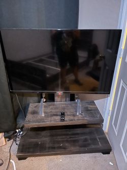 Tv with tv stand (fire stick included)