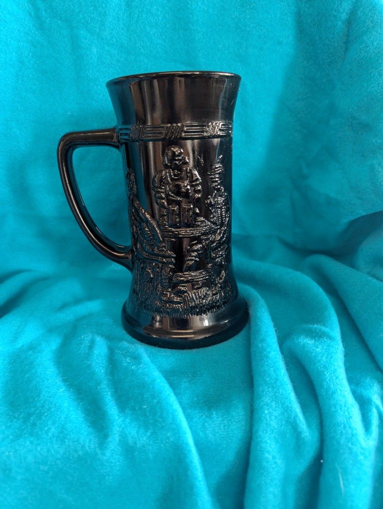 #17 vintage Indiana Glass Tiara Black Amethyst Glass Beer Stein Mug with an embossed tavern scene