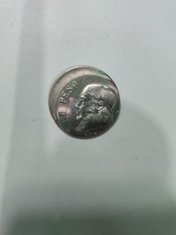 Mexican Un Peso Coin off center