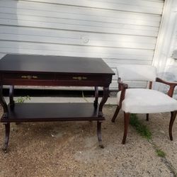 antique desk with drawers and wheels also a chair
