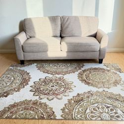 Beautiful and minimalist, modern loveseat sofa and rug/carpet