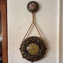 vintage or antique German rope wall clock, a style popular in the mid-20th century.