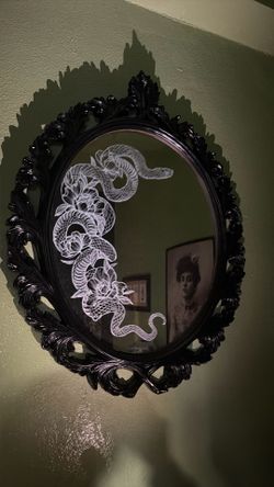 Framed oval mirror