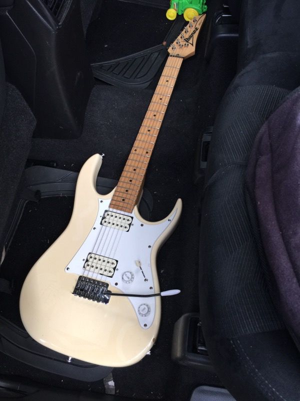 Ibanez RX 20 Series Electric Guitar... Working Condition But have some discoloration, dings, scratches and cracked on edges (see photos for the actua
