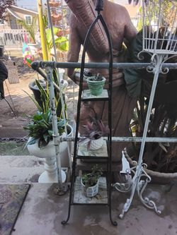 Vintage black plant stand with three planters