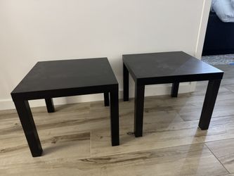 Small black wooden tables