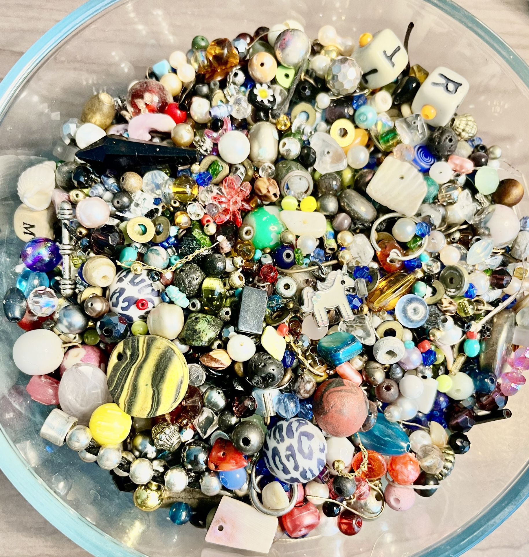 Pretty rocks, trinkets and old beads. About 2 pounds. 