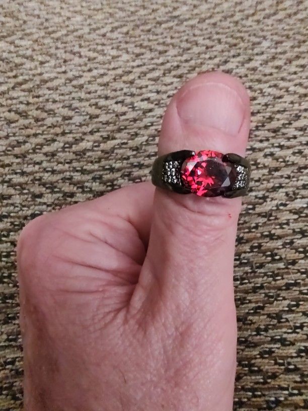 TITANIUM RED GEMSTONE, CZ  RING.  SIZE 12. NEW. PICKUP ONLY