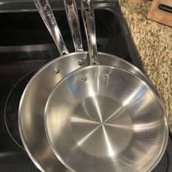Set of 3 Emeril stainless steel pans, 8”,10” and 3QT.