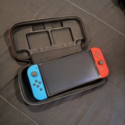 LIKE NEW Nintendo Switch OLED with Case