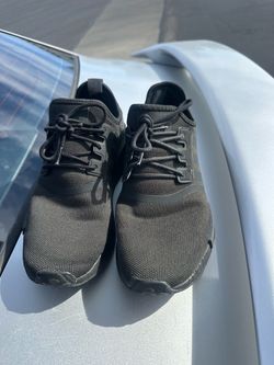 Black Adidas NMD R1 sneakers