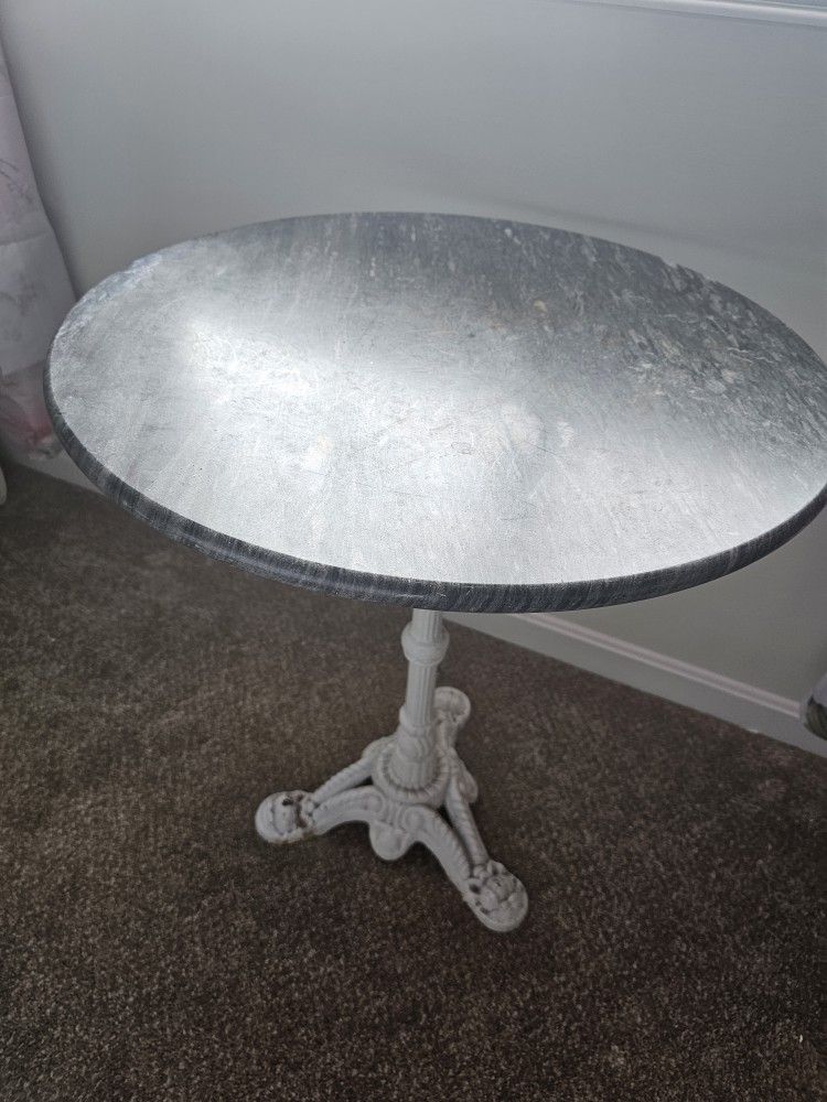 $175.00 - TABLE, CAST IRON/MARBLE TOP! PICKUP THIS SATURDAY AT THE WOODLANDS IN MORROW COMMUNITY GARAGE SALE!