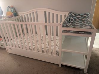 Crib with changing table