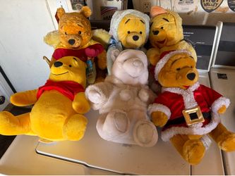 13 Winnie the Pooh Bears.