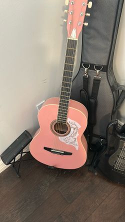 Rogue pink guitar