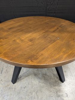 Round Dark Wood Coffee Table with Tapered Legs
