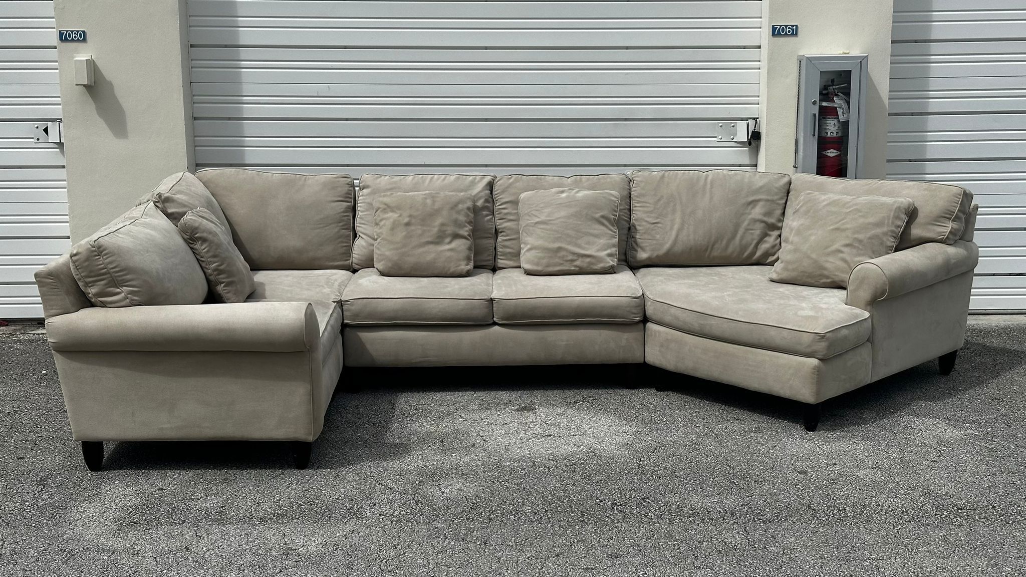 GRAYISH MICROFIBER SECTIONAL SOFA by ASHLEY FURNITURE - delivery is negotiable