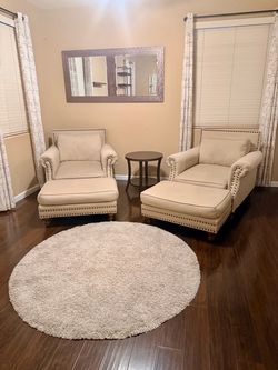 Sitting chairs comfy nail head with mirror table and carpet