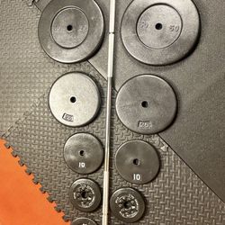 7 ft Standard Steel Barbell with Cast Iron Weight Plates: 50s, 25s, 10s, 7.5s and 5s pounders. Brute W: 220#