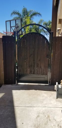 Custom steel gates with integrated rustic wooden planks any size and all styles