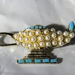 This Magical Vintage Pearl Like Lamp Brooch simply glows brilliantly with rich turquoise glass enhancements.  It is a rare, unique find!