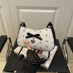 Korean sweet bubble yarn bow armpit bag women‘s high-end black and pink contrast color one-shoulder cross-body bag commuting bag