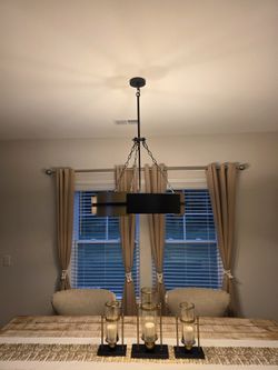 Modern Black and Gold Drum Chandelier. Less than a year oldModern drum chandelier has a dual-tone black and gold metal finish. The fixture is construc