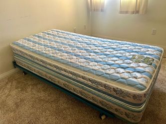 Twin metal bed frame with mattress and box spring