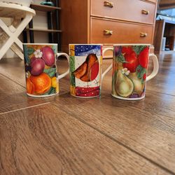 3 ceramic coffee mugs made by Dunoon, fruit-themed designs on the bottom stamps, great condition