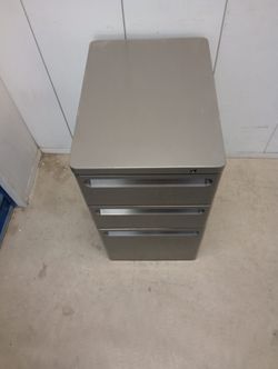 Solid metal file cabinet with key
