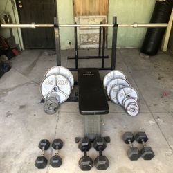 Olympic Bar, Bench, And Weight Set