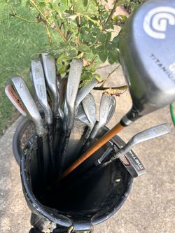 Golf Clubs And Leather Bag